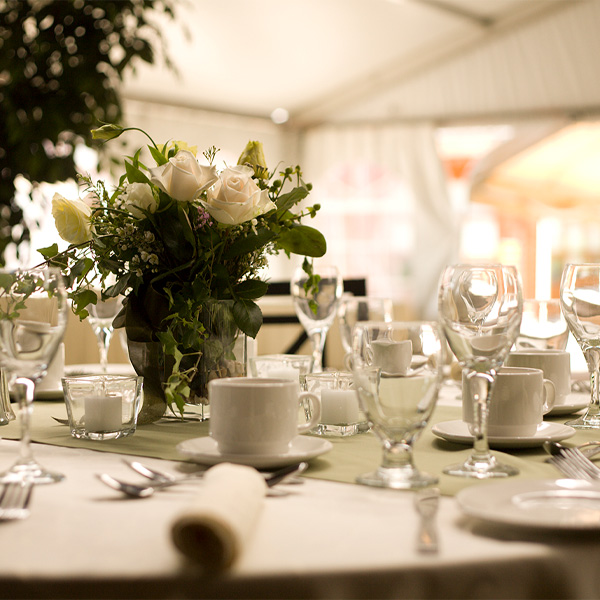 Wedding reception table set awaiting guests and food.